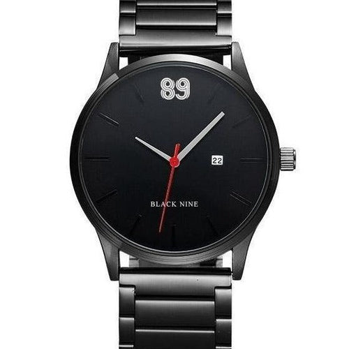 Black wristwatch with red second hand on a white background